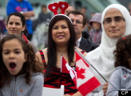 Sherrie Mejilla, centre left, born in Guam and raised in Seattle, Wash., looks on before taking the oath of citizenship during a special Canada Day citizenship ceremony for 60 people in Vancouver, B.C., on Sunday July 1, 2012. THE CANADIAN PRESS/Darryl Dyck (CP)