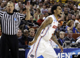 Florida's Mike Rosario (3) reacts after hitting a 3-pointer against Minnesota during the second half of a third-round game of the NCAA college basketball tournament, Sunday, March 24, 2013, in Austin, Texas.