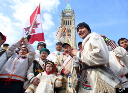 A group of young aboriginal people who travelled 1,600 kilometre on foot from the James Bay Cree community of Whapmagoostui, Quebec celebrate their arrival on Parliament hill in Ottawa, Monday, March 25, 2013. THE CANADIAN PRESS/ Fred Chartrand