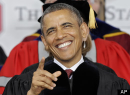 resident Barack Obama laughs at something on the video screen at Ohio Stadium before delivering the commencement speech for Ohio State University's spring commencement Sunday, May 5, 2013, in Columbus, Ohio. (AP Photo/Mark Duncan)