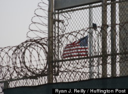 A flag flies over a prison camp at Naval Station Guantanamo Bay last month (Ryan J. Reilly / Huffington Post).