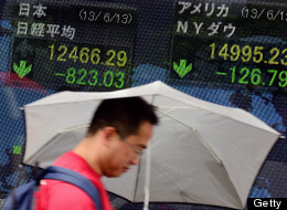 Tokyo stocks plunged more than six percent on June 13 morning after a Wall Street sell-off amid fears the US Federal Reserve will soon begin to wind down its massive stimulus drive. (Photo by TORU YAMANAKA/AFP/Getty Images)