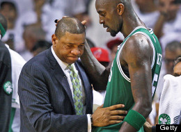 Celtics head coach Doc Rivers, left, and Kevin Garnett, right, share a moment on the sidelines after Garnett left the game as the clock was winding down in the game. The Boston Celtics visited the Miami Heat for game seven of the NBA Eastern Conference Finals at the American Airlines Arena.