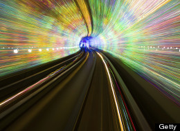 Abstract image of light waves in deep tunnel.