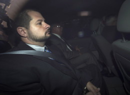 City of Toronto Police Constable James Forcillo is pictured through an unmarked police van as he arrives at the Old City Hall courthouse facing second degree murder charges from the shooting of Sammy Yatim in Toronto, on Tuesday, August 20, 2013. THE CANADIAN PRESS/Nathan Denette