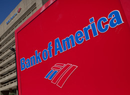 The Bank of America Corp. logo is displayed in front of a branch in Galveston, Texas, U.S., on Saturday, Oct. 1, 2011. Bank of America Corp. (BAC) should face fraud proceedings after its Countrywide unit submitted faulty data to back up claims for reimbursement on federally insured mortgages, according to an audit by a U.S. watchdog. Photographer: Scott Eells/Bloomberg via Getty Images