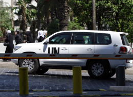 After being attacked by snipers, U.N. experts collected samples and testimony from Syrian doctors and victims of an alleged chemical weapons attack. (Photo by LOUAI BESHARA/AFP/Getty Images)