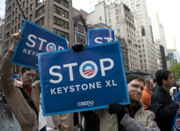 Environmental activists march through midtown protesting the proposed Keystone XL pipeline, May 13, 2013 in New York. TransCanada’s Keystone XL pipeline will increase carbon emissions by the equivalent of 51 coal-fired power plants or 37 million new cars on the road, says a new report from a coalition of environmental groups. (DON EMMERT/AFP/Getty Images)