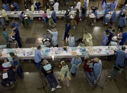 The number of uninsured people, like these patients lined up for dental treatment in Knoxville, Tenn., stayed about the same at 48 million in 2012, according to census data.