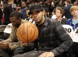 Drake shows his love for the game sitting courtside during the contest featuring the Toronto Raptors and the Cleveland Cavaliers at the Air Canada Centre in Toronto