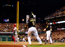 PITTSBURGH, PA - OCTOBER 06: Josh Harrison #5 of the Pittsburgh Pirates celebrates scoring in the eighth inning against the St. Louis Cardinals during Game Three of the National League Division Series at PNC Park on October 6, 2013 in Pittsburgh, Pennsylvania. (Photo by Jared Wickerham/Getty Images)