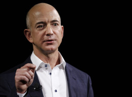 Jeff Bezos, chief executive officer of Amazon.com Inc., introduces the Kindle Fire HD tablets at a news conference in Santa Monica, California, U.S., on Thursday, Sept. 6, 2012. Amazon.com Inc. is updating its line of Kindle e-readers and tablets in a bid to stoke consumer demand as Google Inc. and Microsoft Corp. join the crowded market of machines challenging Apple Inc.?s iPad. Photographer: Patrick Fallon/Bloomberg via Getty Images