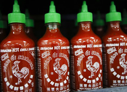 Huy Fong Foods Inc. Sriracha sauce is displayed for sale during the grand opening of a Wal-Mart Stores Inc. location in the Chinatown neighborhood of Los Angeles, California, U.S., on Thursday, Sept. 19, 2013. Wal-Mart Stores Inc. will phase out 10 chemicals it sells in favor of safer alternatives and disclose the chemicals contained in four product categories, the company announced Sept. 12. Photographer: Patrick T. Fallon/Bloomberg via Getty Images