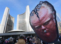 As council debates Denzil Minnan-Wong's motion on Toronto Mayor Rob Ford hundreds gather outside to call for the Mayor to resign in Nathan Phillips Square at City Hall in Toronto on Nov. 13. (Steve Russell/Toronto Star via Getty Images)