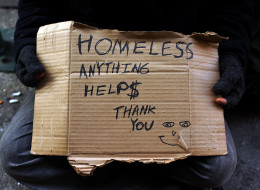 NEW YORK, NY - DECEMBER 04: A person in economic difficulty holds a homemade sign asking for money along a Manhattan street on December 4, 2013 in New York City. According to a recent study by the by the United States Department of Housing and Urban Development, New York City's homeless population increased by 13 percent at the beginning of this year. Despite an improving local economy, as of last January an estimated 64,060 homeless people were in shelters and on the street in New York. Only