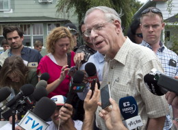Rail World Inc. president Edward Burkhardt speaks to the media as he tours Lac-Megantic, Que., on Wednesday, July 10, 2013. Looking back at the year as it comes to a close, Burkhardt said he's still troubled by the Quebec derailment and has thought about it every day since the July 6 catastrophe killed 47 people and destroyed part of the town. (THE CANADIAN PRESS/Paul Chiasson)