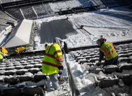 Crews work to remove snow from MetLife Stadium, which will host Superbowl XLVIII next month, on January 22, 2014 in East Rutherford, New Jersey. In what is being called the first ever 'cold weather superbowl,' the Denver Broncos and Seattle Seahawks will face off in front of over 80,000 fans. Cold weather welcome kits have been produced for fans that will include earmuffs, hats, mittens, hand warmers, lip balm, and tissues, among other items. After a snowstorm hit the New York region with a foot