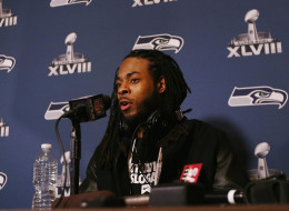 Richard Sherman of the Seattle Seahawks addresses the media at the Westin Hotel on January 26, 2014 in Jersey City, New Jersey. (Photo by Elsa/Getty Images)