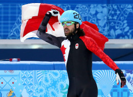 Gold medalist Charles Hamelin of Canada celebrates after wiining the Short Track Men's 1500m Final on day 3 of the Sochi 2014 Winter Olympics at Iceberg Skating Palace on February 10, 2014 in Sochi, Russia. (Photo by Streeter Lecka/Getty Images)