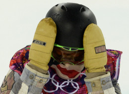 Shaun White reacts to his first run in the Men's Snowboard Halfpipe Final at the Rosa Khutor Extreme Park during the Sochi Winter Olympics on February 11, 2014.