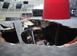 A sinkhole opened inside the National Corvette Museum and swallowed 8 cars Wednesday.