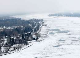 In this Feb. 6, 2014 aerial photo is the ice covered St. Clair River with the Canadian shoreline on the left. The Great Lakes were 88 per cent frozen this week, the most they've been in 20 years.