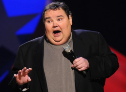 NASHVILLE, TN - FEBRUARY 21:  Comedian John Pinette performs as part of CMT Presents Ron White's Comedy Saltue To The Troops at The Grand Ole Opry on February 21, 2012 in Nashville, Tennessee.  (Photo by Rick Diamond/Getty Images for CMT)
