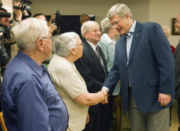 Prime Minister Stephen Harper geets seniors at a campaign event in Riviere du Loup, Quebec on Wednesday April 20, 2011. THE CANADIAN PRESS/Frank Gunn