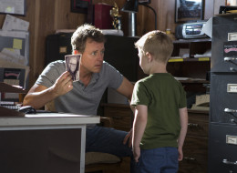 Greg Kinnear, left, and Connor Corum in a scene from
