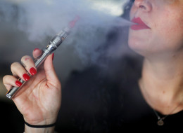 A woman enjoys an electronic cigarette. (Photo by Joe Raedle/Getty Images)