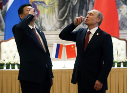 President of Russia Vladimir Putin and Chinese President Xi Jinping toast with vodka during a signing ceremony on May 21, 2014 in Shanghai, China. Russia and China signed a thirty-year contract for supply of gas. (Photo by Sasha Mordovets/Getty Images)