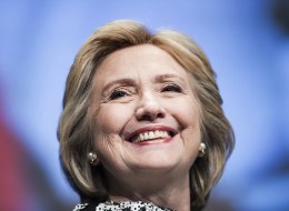 Former Secretary of State Hillary Clinton smiles before speaking at the World Bank May 14, 2014 in Washington, DC. (BRENDAN SMIALOWSKI/AFP/Getty Images)