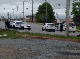 A salvage yard in Dartmouth, Nova Scotia is surrounded by police following reports of an armed man.