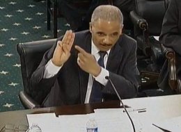 Attorney General Eric Holder gives the Boy Scout oath during testimony before Congress earlier this year. (Photo: House.gov)