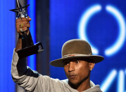 Singer Pharrell Williams accepts Video of the Year for 'Happy' onstage during the BET AWARDS '14 at Nokia Theatre L.A. LIVE on June 29, 2014 in Los Angeles. (Photo by Kevin Winter/Getty Images for BET)