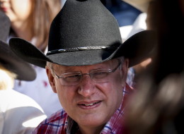 Prime Minister Stephen Harper hammered Liberal leader Justin Trudeau in a speech to party faithful at his annual Calgary Stampede barbecue on Saturday. (CP)