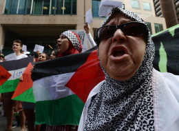 Tempers flared briefly as protesters marched through downtown Ottawa today, calling on Prime Minister Stephen Harper to denounce Israel's military actions in Gaza. (CP)