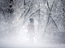 A man walks along in blowing snow Wednesday, Jan. 21, 2015, in Bridgeton, N.J. (AP Photo/Mel Evans)