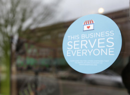 A window sticker on a downtown Indianapolis business announces objection to the Religious Freedom bill passed by the Indiana legislature. (AP Photo/Michael Conroy)