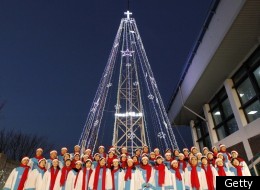 South Korean Christians sing a hymn in front of a Christmas tree atop a military-controlled hill near the tense land border in Gimpo, west of Seoul, on December 21, 2010. (KIM JAE-MYUNG/AFP/Getty Images)