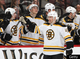 OTTAWA, CANADA - DECEMBER 14: Rich Peverley #49 of the Boston Bruins celebrates a second period goal with team mates during an NHL game against the Ottawa Senators at Scotiabank Place on December 14, 2011 in Ottawa, Ontario, Canada. (Photo by Jana Chytilova/Freestyle Photography/Getty Images)