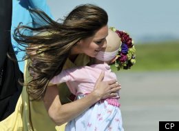 The Duchess of Cambridge hugs six-year-old Diamond Marshall as the Royal Couple arrives in Calgary Thursday, July 7, 2011. THE CANADIAN PRESS/Nathan Dentte