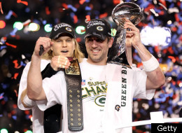 ARLINGTON, TX - FEBRUARY 06: Super Bowl MVP Aaron Rodgers #12 of the Green Bay Packers holds up the Vince Lombardi Trophy as Clay Matthews #52 looks on after winning Super Bowl XLV 31-25 against the Pittsburgh Steelers at Cowboys Stadium on February 6, 2011 in Arlington, Texas. (Photo by Al Bello/Getty Images)