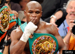 LAS VEGAS, NV - SEPTEMBER 17: Floyd Mayweather Jr. is carried in the ring by CEO of Mayweather Promotions Leonard Ellerbe as they celebrate Mayweather's fourth-round knockout of Victor Ortiz to win the WBC welterweight title September 17, 2011 in Las Vegas, Nevada. (Photo by Ethan Miller/Getty Images)