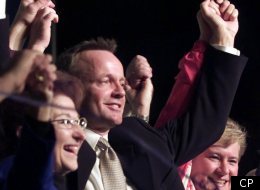 Canadian Alliance Leader Stockwell Day hoists hands with Alliance Member of Parliament Deborah Grey (right) and Candidate Betty Unger following his speech at a rally in Edmonton Alberta Saturday Nov. 25, 2000.