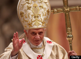 VATICAN CITY, VATICAN - DECEMBER 25: Pope Benedict XVI waves to the faithfuls as he leaves St. Peter's Basilica at the end of the Christmas night mass on December 25, 2011 in Vatican City, Vatican. (Photo by Franco Origlia/Getty Images)