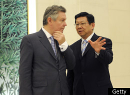 China's Commerce Minister Chen Deming (R) talks with the European Union's trade Commissioner Karel De Gucht at the press conference in Beijing on July 14, 2011.