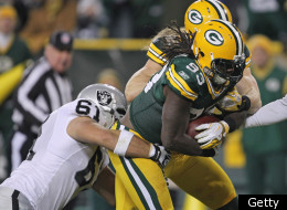 GREEN BAY, WI - DECEMBER 11: Erik Walden #93 of the Green Bay Packers drags Stefan Wisniewski #61 the Oakland Raiders into the end zone to score a touchdown after recovering a loose ball at Lambeau Field on December 11, 2011 in Green Bay, Wisconsin. The Packers defeated the Raiders 46-16. (Photo by Jonathan Daniel/Getty Images)