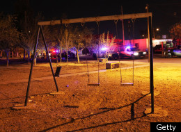 Ciudad Juarez: swing set is empty of children at a crime scene involving the killing of a 13 year old boy in a car