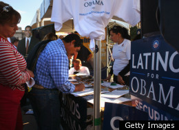 FILE PHOTO: DENVER - SEPTEMBER 14, 2008: A new voter registers at a Democratic Party booth at a celebration marking Mexican Independence Day September 14, 2008 in Denver, Colorado. The Democratic Party is working hard to register Latino voters in Colorado.